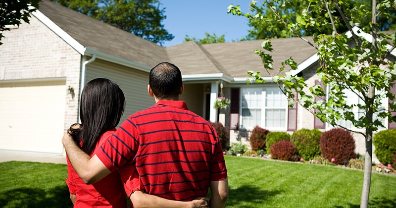 Homeowners Looking at Their New Roof